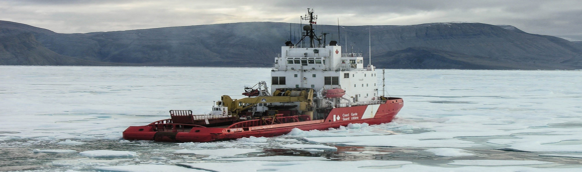 Canadian Coast Guard icebreaker clearing ice from a bay.