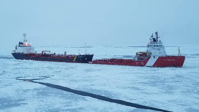 CCGS Captain Molly Kool towing another ship during icebreaking operations.